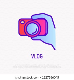 Filming Vlog: Camera In Hand Thin Line Icon. Modern Vector Illustration For Video Logo.