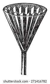 Filter paper inserted into the funnel, vintage engraved illustration.
