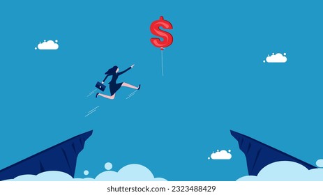 Financial success. Businesswoman jumping and grabbing dollar balloon