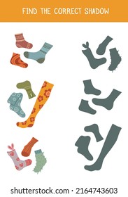 Find the correct shadow. Vector children educational game.  Various cartoon socks and stockings. Find right gray silhouette for clothes. Vertical template of worksheet for preschool lessons.