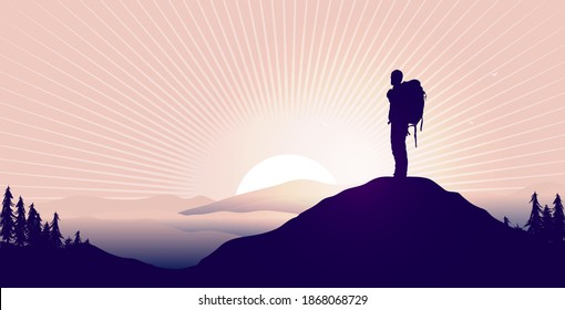 Find meaning in life - Silhouette of backpacker on hilltop watching epic landscape and sunrise. 