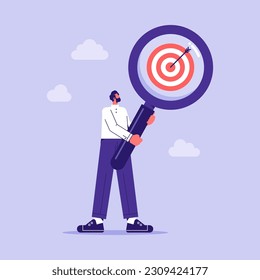 Finding or analyzing business goals and targets concept, businessman with magnifier focuses on the target, focusing