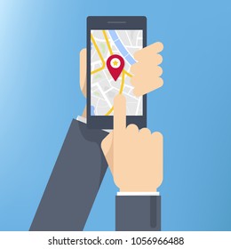 Finding the way concept. Hand holding smartphone and touching screen with mobile map gps navigation.