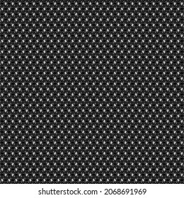 Fine textile cloth dotted in black and white. Wool or cotton fabric.