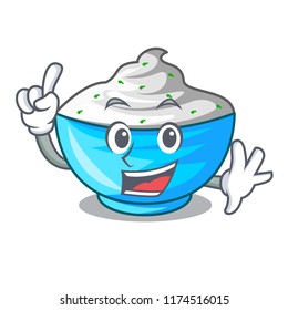 Finger bowl of sour cream on cartoon wooden table