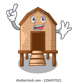 Finger chicken in a wooden cartoon coop