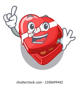 Finger chocolate heart box above cartoon fridge