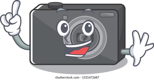 Finger digital camera on a cartoon table