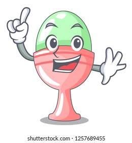 Finger in egg cup isolated on character