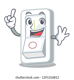 Finger light switch above cartoon wooden wall