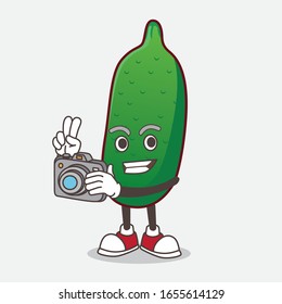 Finger Lime Fruit cartoon mascot character as photographer in action with a camera