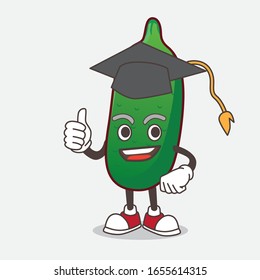 Finger Lime Fruit cartoon mascot character in a black Graduation hat