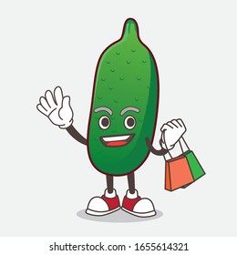 Finger Lime Fruit cartoon mascot character waving and holding Shopping bag