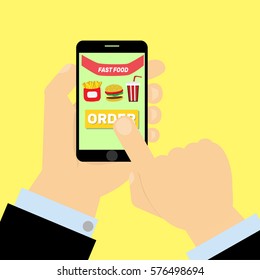 Finger presses order fast food button on smartphone