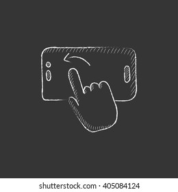 Finger touching smartphone. Drawn in chalk icon.