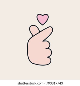 Fingers show the Korean symbol of love. Heart over hand.
