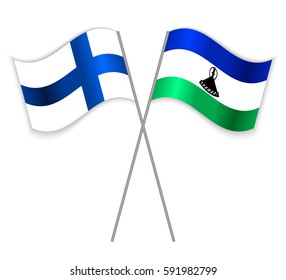Finnish and Basotho crossed flags. Finland combined with Lesotho isolated on white. Language learning, international business or travel concept.