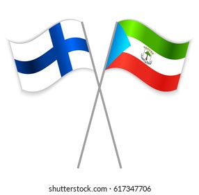 Finnish and Equatorial Guinean crossed flags. Finland combined with Equatorial Guinea isolated on white. Language learning, international business or travel concept.