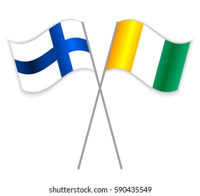Finnish and Ivorian crossed flags. Finland combined with Ivory Coast isolated on white. Language learning, international business or travel concept.