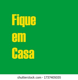 Fique em casa (Stay at home in portuguese). Inscription stay home on green background