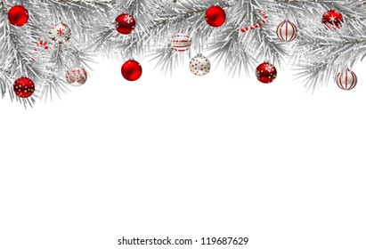  Fir branches covered with snow and decorated with Christmas baubles
