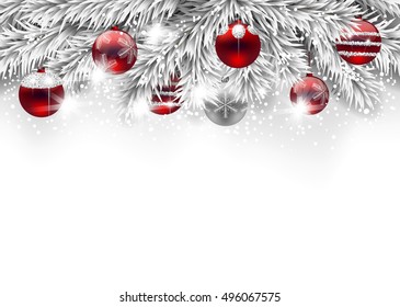 Fir branches decorated with Christmas baubles on white background with space for text.
