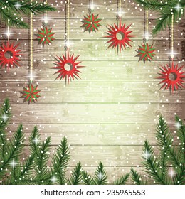 Fir tree branches and hanging toys on the wooden board background. Christmas vector illustration. 