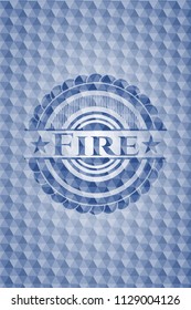Fire blue badge with geometric background.