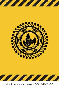 fire icon black grunge emblem with yellow background. Vector Illustration. Detailed.