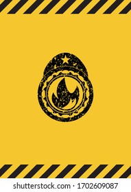 fire icon grunge black emblem with yellow background, warning sign. Vector Illustration. Detailed. 