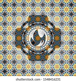 fire icon inside arabesque style badge. arabic decoration.