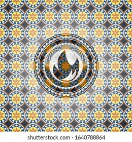 fire icon inside arabic badge. Arabesque decoration.