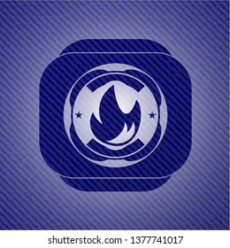 fire icon inside badge with denim texture