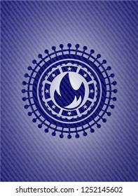 fire icon inside badge with jean texture
