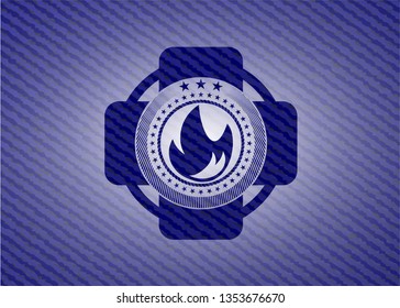 fire icon inside badge with jean texture