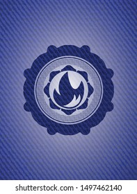 fire icon inside badge with jean texture