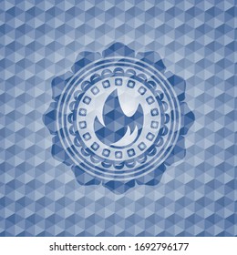 fire icon inside blue emblem or badge with abstract geometric pattern background. 