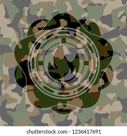 fire icon inside camouflaged emblem