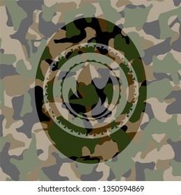 fire icon inside camouflaged emblem