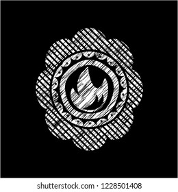 fire icon inside chalkboard emblem