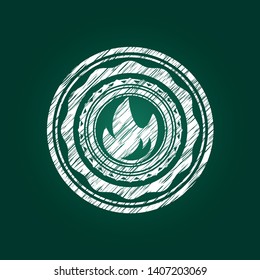 fire icon inside chalkboard emblem on black board