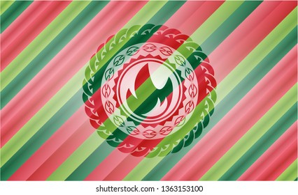fire icon inside christmas badge background.