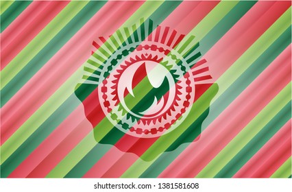 fire icon inside christmas emblem background.