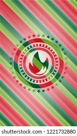 fire icon inside christmas style emblem.