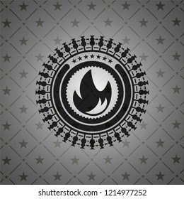 fire icon inside dark badge or emblem