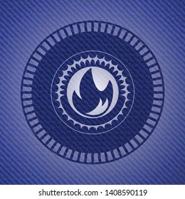 fire icon inside emblem with denim high quality background