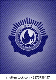 fire icon inside emblem with jean high quality background