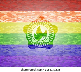 fire icon inside emblem on mosaic background with the colors of the LGBT flag