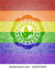fire icon inside emblem on mosaic background with the colors of the LGBT flag