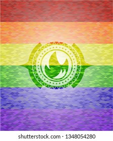 fire icon inside emblem on mosaic background with the colors of the LGBT flag